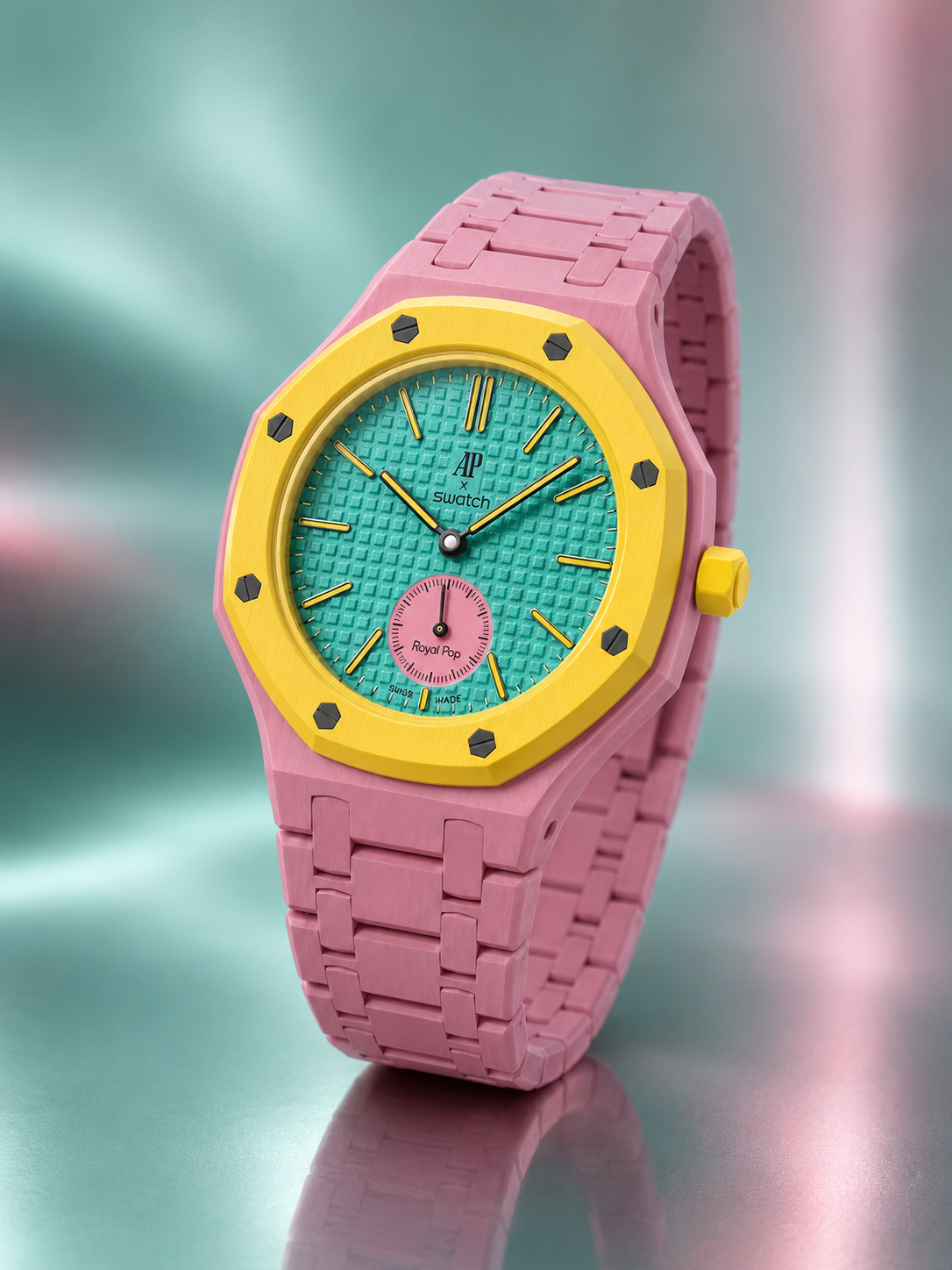 Colorful watch with pink strap and turquoise face on a reflective surface